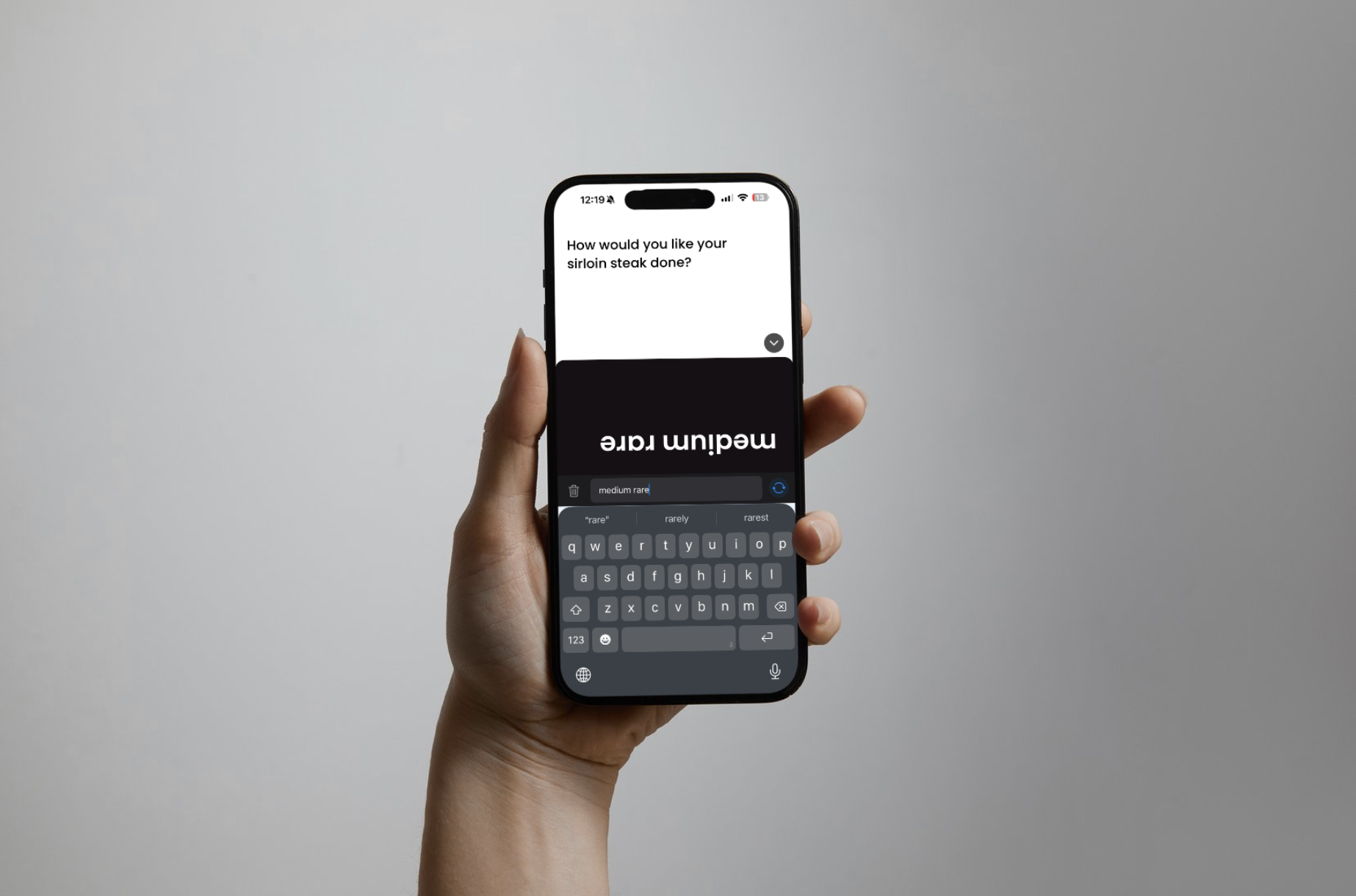 iPhone showing live captions for a dinner question and Big Reply text for the response medium rare